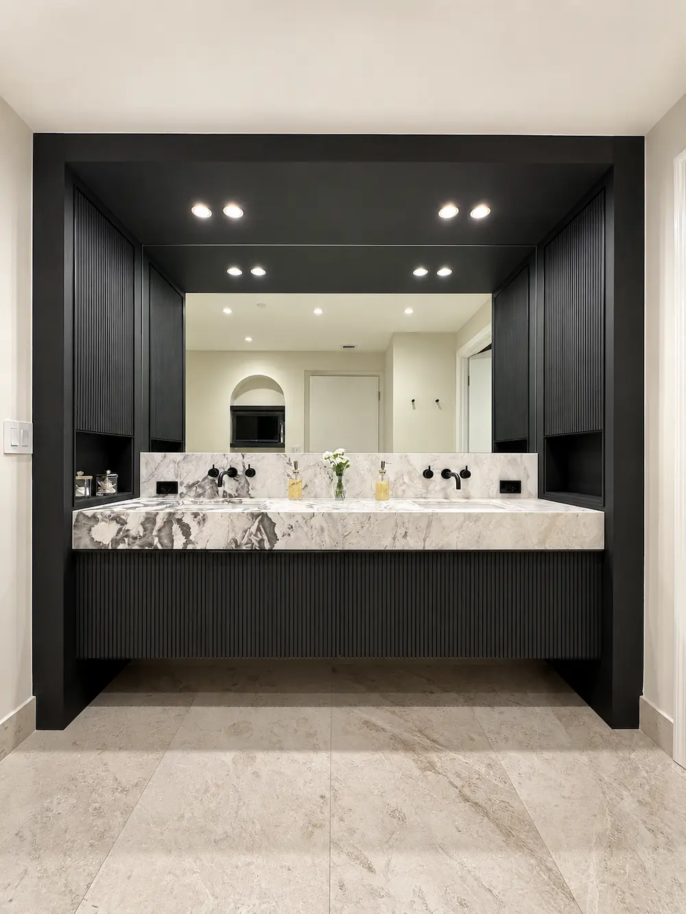 Majestic Tower Unit 909 — warm wood vanity and elegant finishes